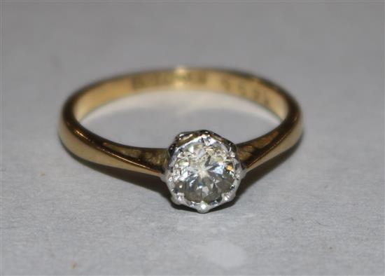 An 18ct gold and platinum solitaire diamond ring, size J.